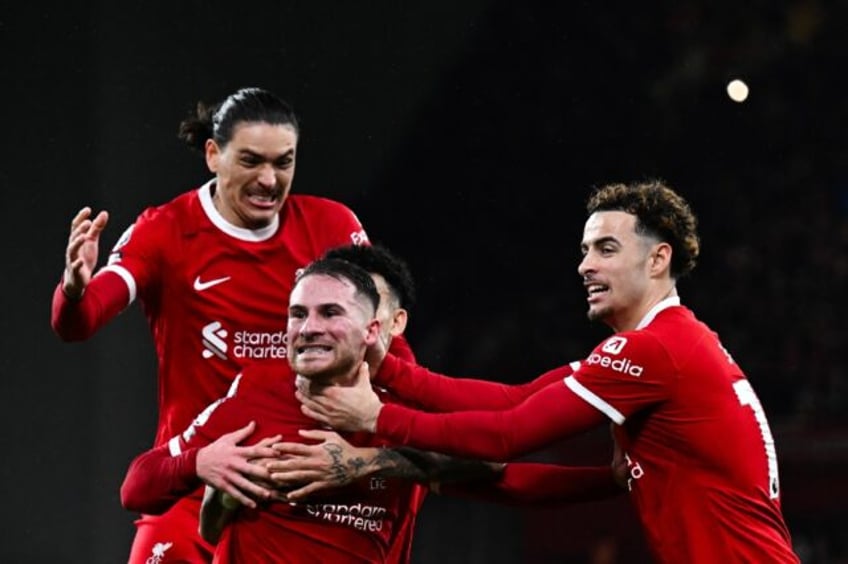 Liverpool's Alexis Mac Allister (C) celebrates after scoring against Sheffield United