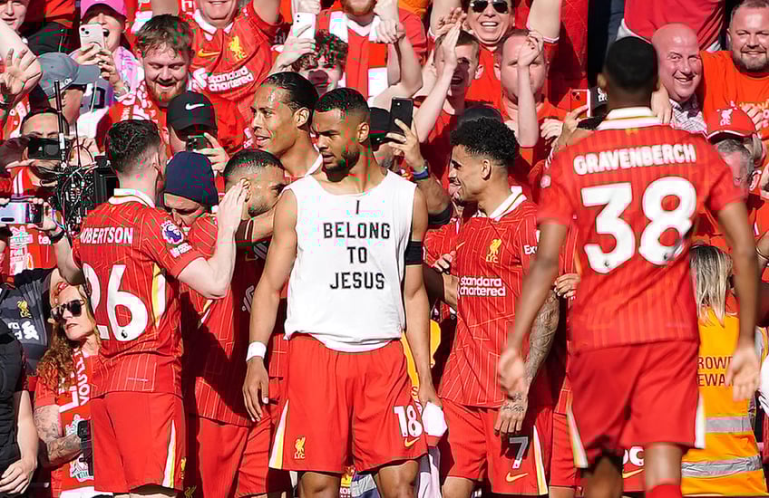 liverpool footballer warned for unveiling i belong to jesus t shirt