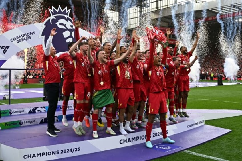 Liverpool's Virgil van Dijk lifts the Premier League trophy
