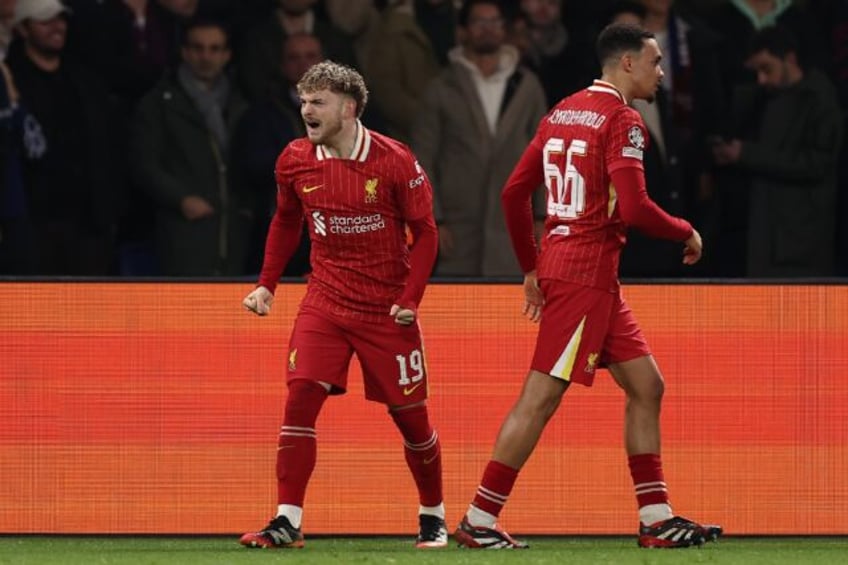 Harvey Elliott (L) scored with his first touch after coming on for Mohamed Salah