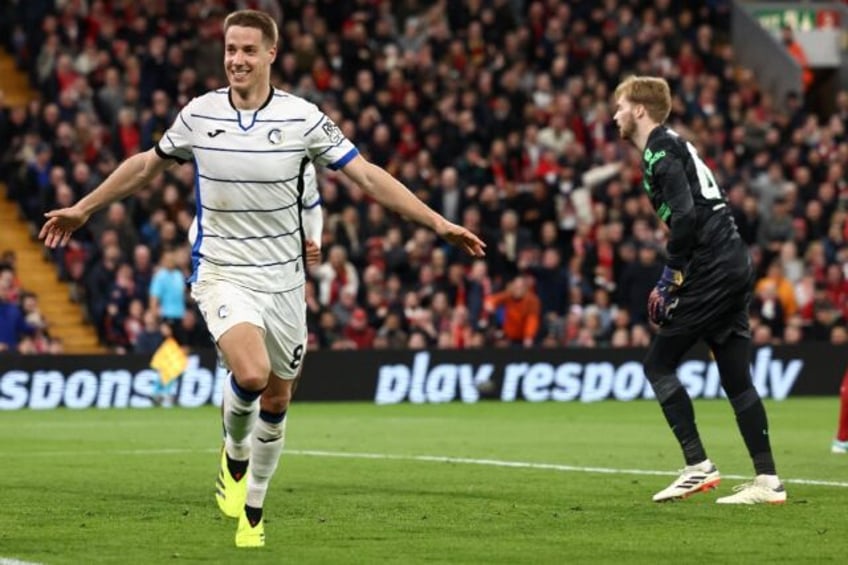 Mario Pasalic (L) celebrates after scoring Atalanta's third goal in their stunning win ove