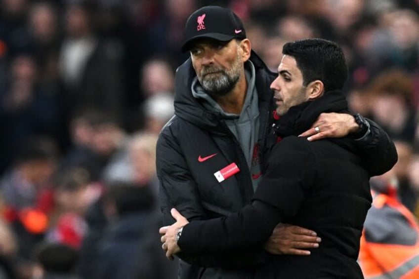 Liverpool manager Jurgen Klopp (L) and Arsenal's Mikel Arteta after their 2-2 Premier League draw at Anfield