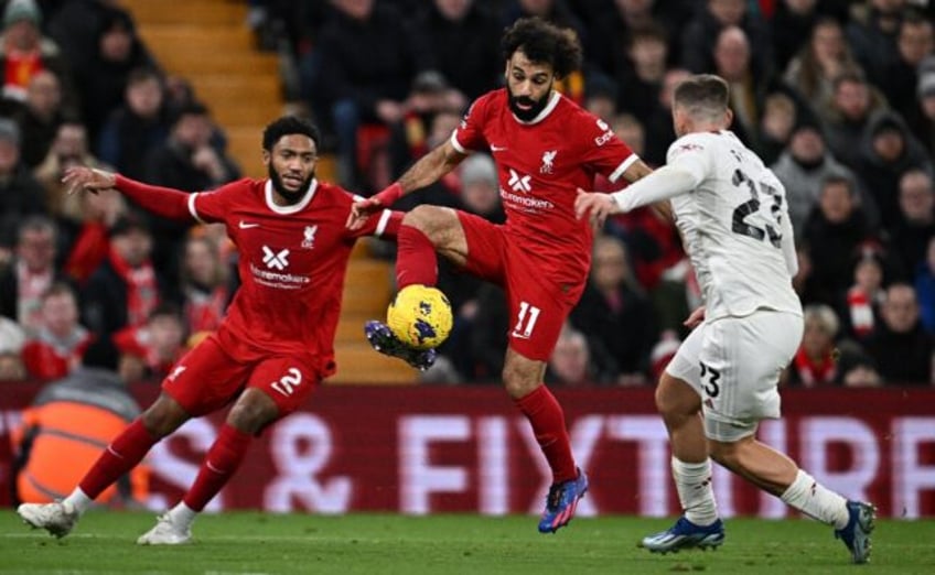 Mohamed Salah (centre) could start for Liverpool against Manchester United