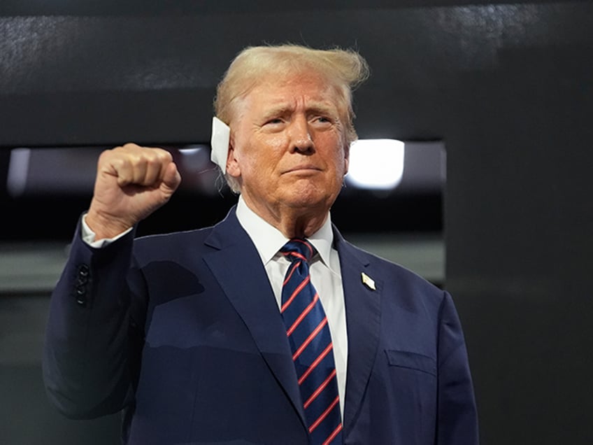 Republican presidential candidate former President Donald Trump gestures as he arrives at