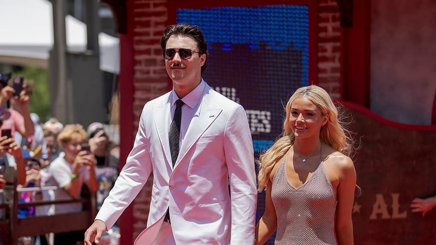 Paul Skenes and Livvy Dunne walk on red carpet