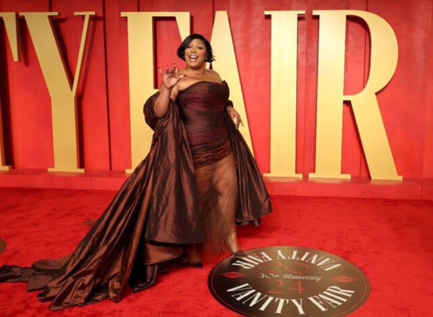 Pop star Lizzo, seen here attending the 2024 Vanity Fair Oscar Party, said she is "tired o