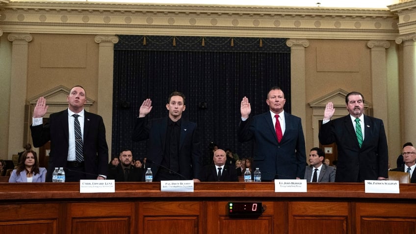 From left, Sgt. Edward Lenz, Commander of Butler County Emergency Services Unit, Patrolman Drew Blasko of Butler Township Police Dept., Lt. John Herold of Pennsylvania State Police, and former U.S. Secret Service agent Patrick Sullivan, swear in at the first public hearing of a bipartisan congressional task force investigating the assassination attempts against Republican presidential nominee former President Donald Trump, at Capitol Hill in Washington, Thursday, Sept. 26, 2024.