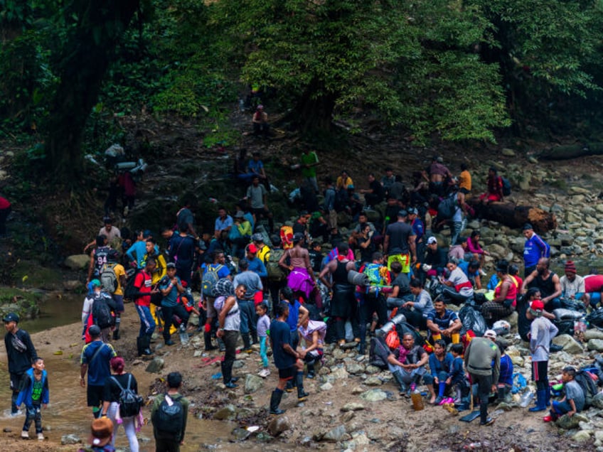 DARIEN GAP, COLOMBIA - NOVEMBER 20: Migrants, mostly from Ecuador, Haiti and Nigeria, paus