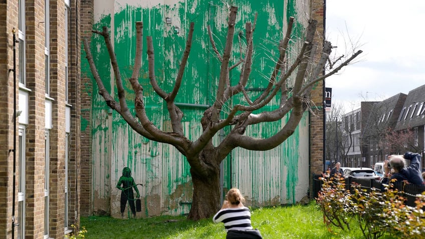 A new Banksy painting on a wall in London