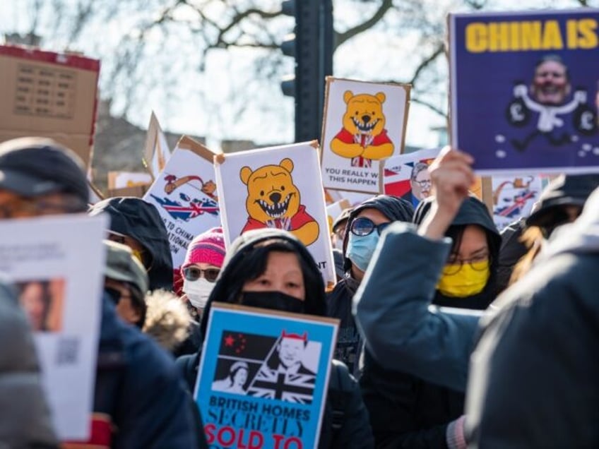 LONDON, ENGLAND - MARCH 15: Demonstrators protest near Tower Bridge over plans to build a