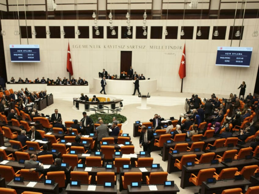 Turkish lawmakers vote in favor of Finland's bid to join NATO, late Thursday, March 30, 2023, at the parliament in Ankara, Turkey. All 276 lawmakers present voted unanimously in favor of Finland's bid, days after Hungary's parliament also endorsed Helsinki's accession.(Burhan Ozbilici/AP)