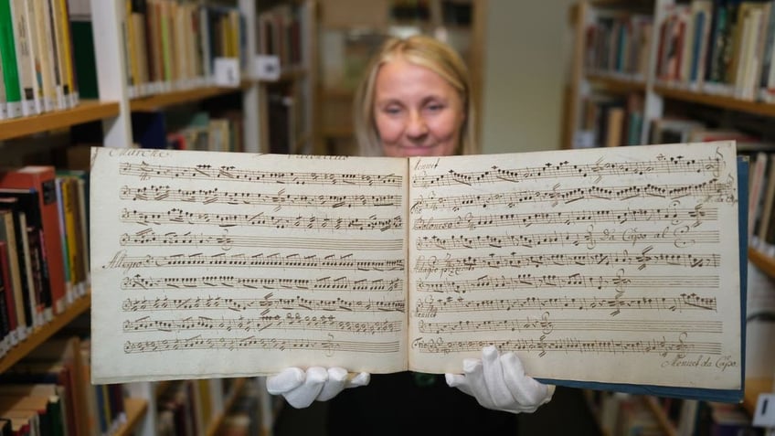 Woman holding manuscript