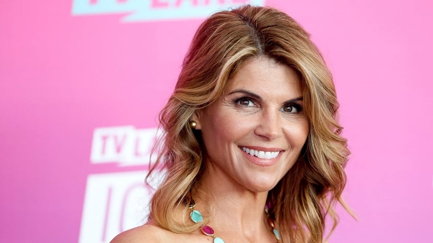 Lori Loughlin smiling on red carpet