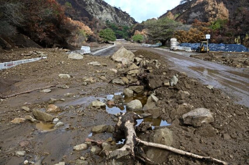 Mud and boulders have washed onto roads in the Palisades Fire burn scar after heavy rain r