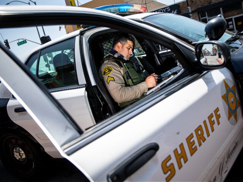 LOS ANGELES, CA - April 16: Los Angeles County Sheriffs deputy Manan Butt prepares to issu