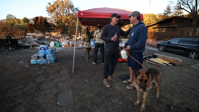 Aaron Lubeley greets a neighbor 