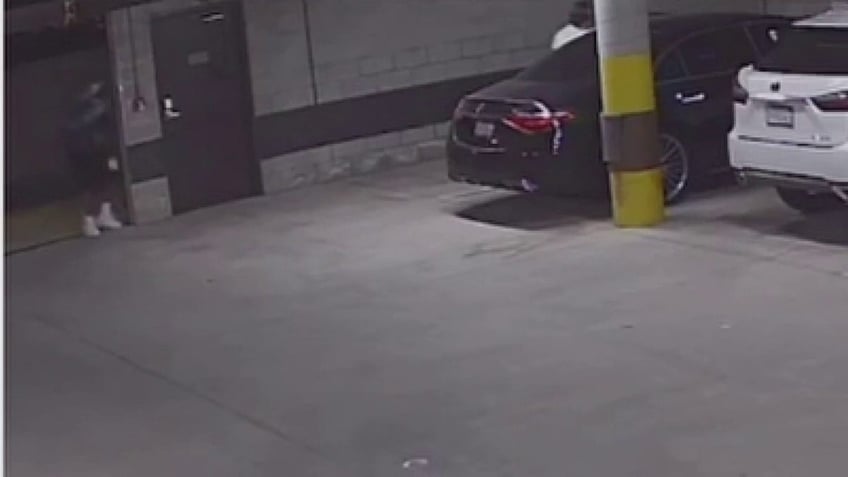 los angeles woman robbed at gunpoint after suspect follow her into parking garage video shows