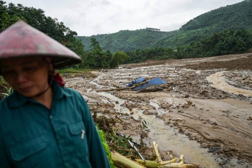 A massive landslide engulfed the village of Lang Nu, killing at least 30 people with anoth