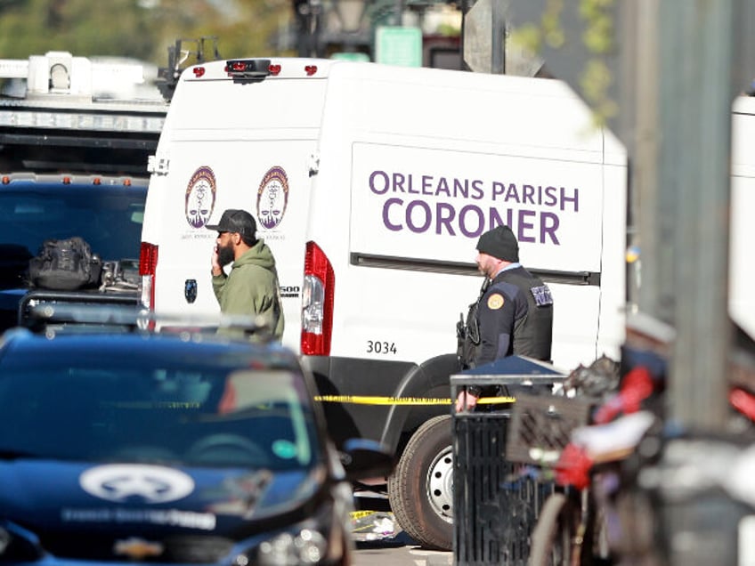 The Orleans Parish Coroner van returns to the scene on Bourbon Street after at least ten p