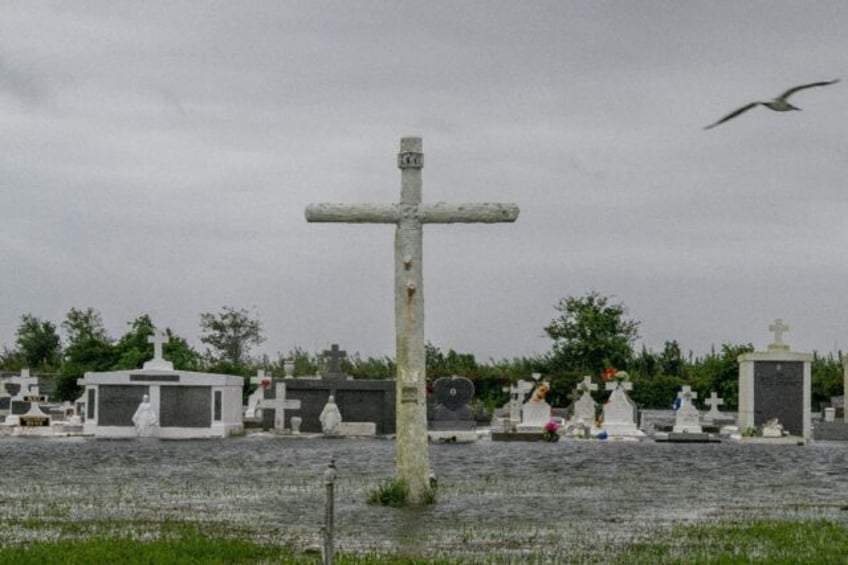 Floodwater fills a cemetery as Hurricane Francine moves in on September 11, 2024 in Dulac,