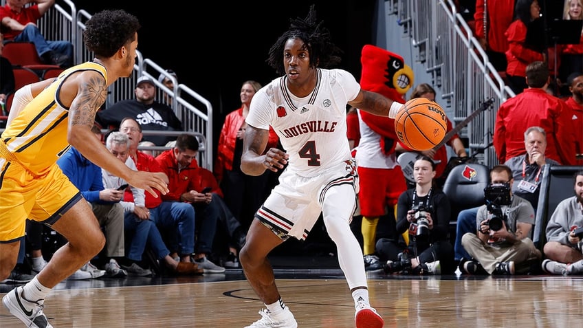 louisville freshman barely plays in first half due to not having tights that he wanted coach says