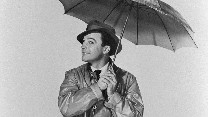 Gene Kelly in a black and white promotional still for "Singing in the Rain"