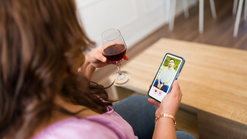 woman swipes on dating app