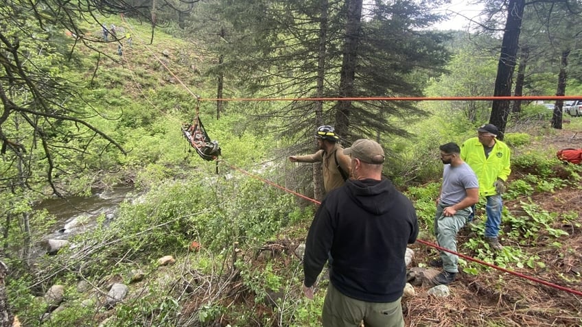 Officials standing over embankment