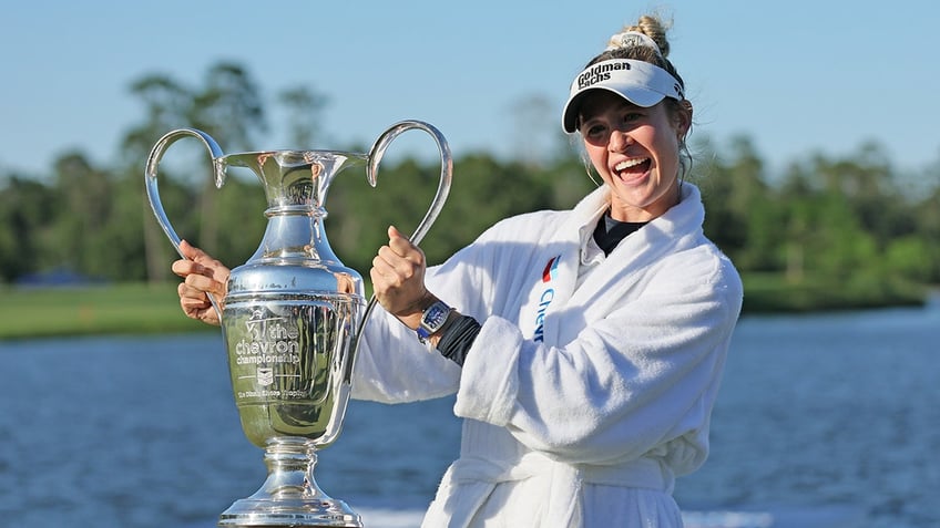 Nelly Korda poses with trophy