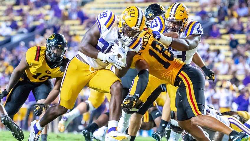 lsu freshman running back bulldozes defender to ground this guy is a monster