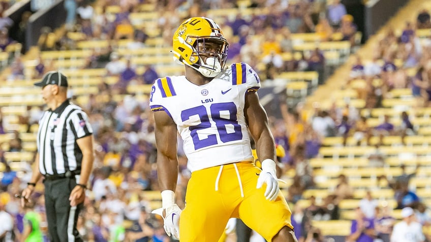 lsu freshman running back bulldozes defender to ground this guy is a monster