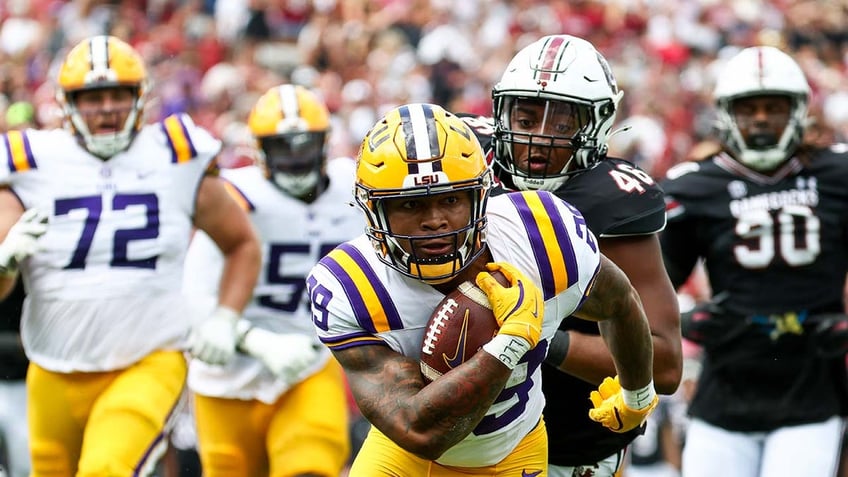 LSU player runs with the football