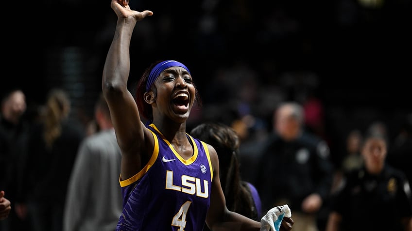 Flau'Jae Johnson celebrates on court