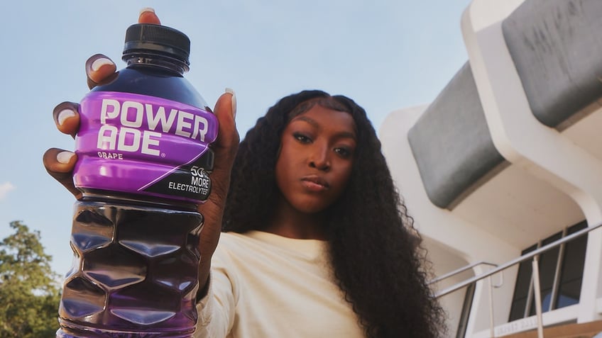 Flau'Jae Johnson holds up POWERADE