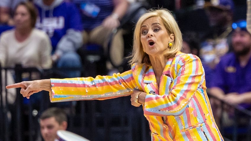 Kim Mulkey points on court