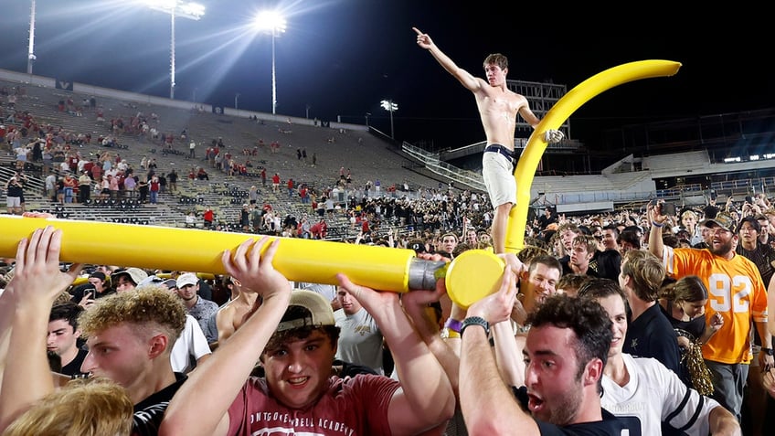 Vanderbilt fan on goal post