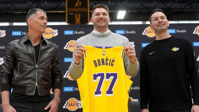 Luka Doncic with Rob Pelinka and JJ Redick