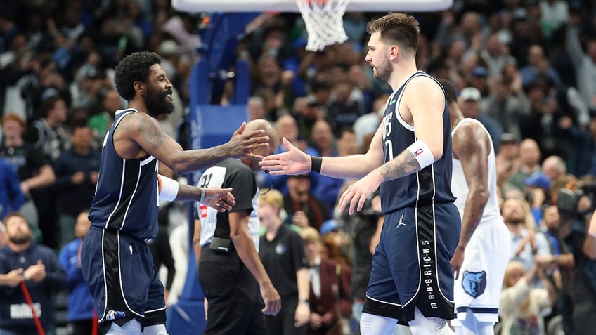 Luka Doncic and Kyrie Irving high-five