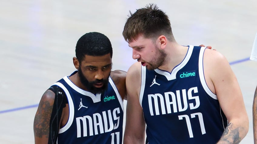 Luka Doncic and Kyrie Irving speak on court