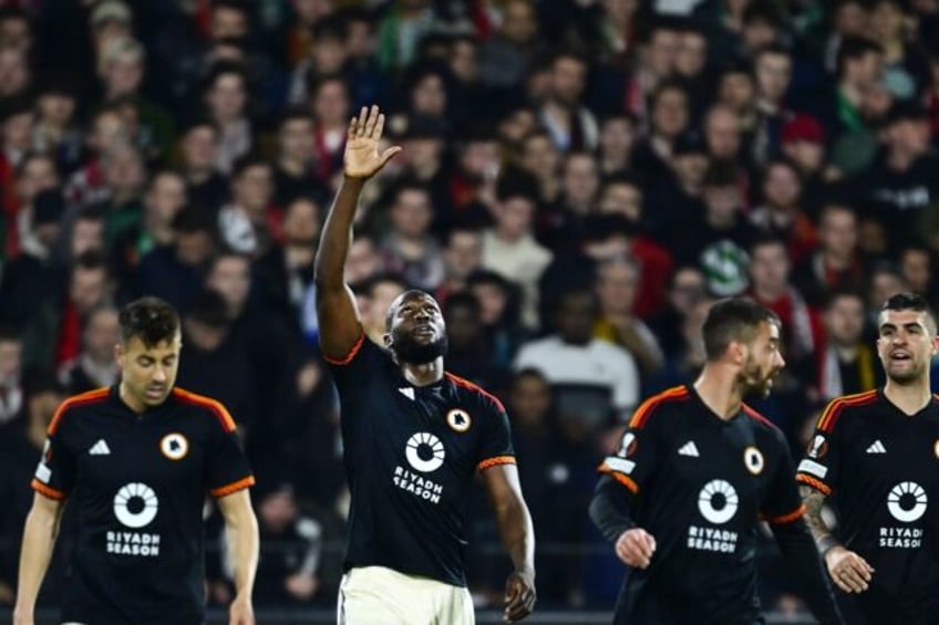 Romelu Lukaku (centre) celebrates after he met a cross with his shoulder to send the ball