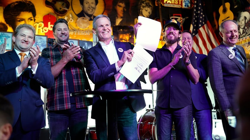 Luke Bryan with Tennessee Governor Bill Lee at the signing of the ELVIS Act