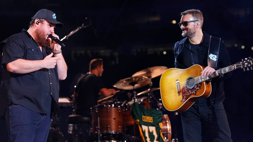 luke combs and eric church performing together