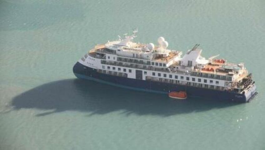 luxury cruise ship runs aground in remote greenland