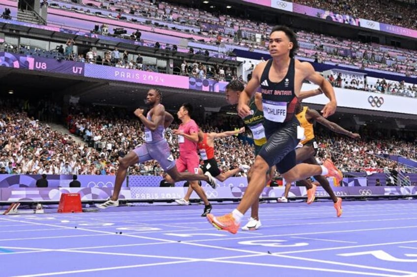 Britain's Louie Hinchliffe (R) crosses the finish line ahead of US' Noah Lyles (L) in the