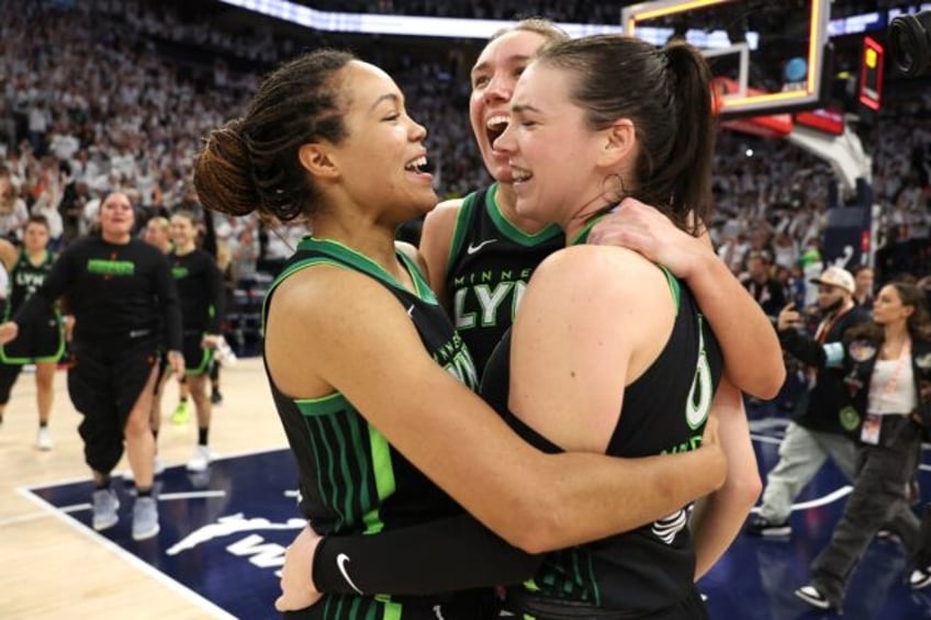 Napheesa Collier and Bridget Carleton of the Minnesota Lynx celebrate with after defeating