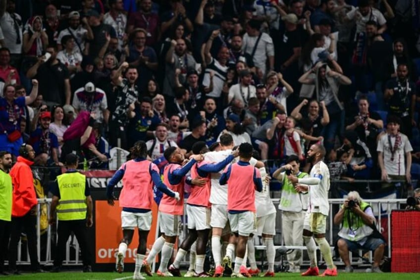 Lyon celebrate after scoring a goal during their dramatic 4-3 home win against Brest