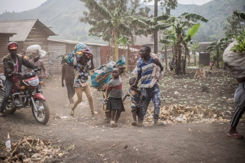 People in eastern DR Congo flee the area of Minova seized by M23 fighters