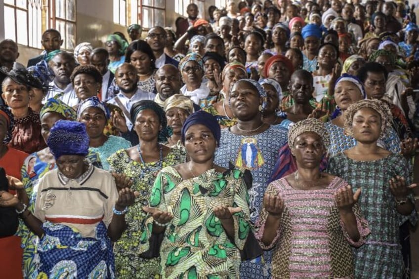 People pray for peace in the Democratic Republic of Congo at a church in Bukavu