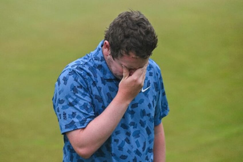 Robert MacIntyre of Scotland wipes away tears after winning the PGA Canadian Open with his