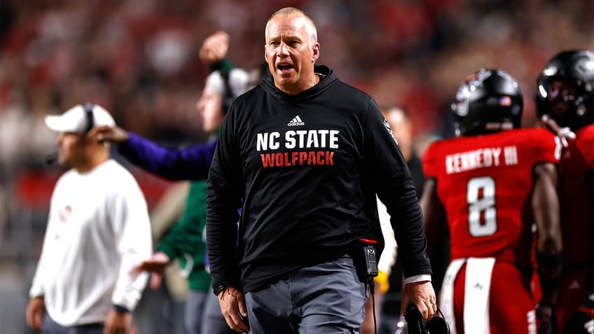 Dave Doeren coaches against Miami